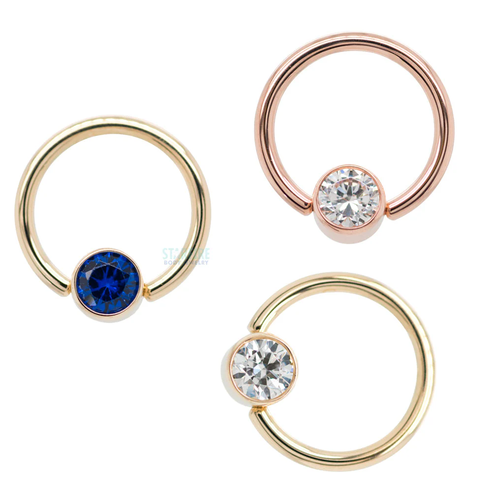 Captive Bead Ring (CBR) in Gold with Bezel-set Synthetic Tanzanite Captive Bead - Image 2